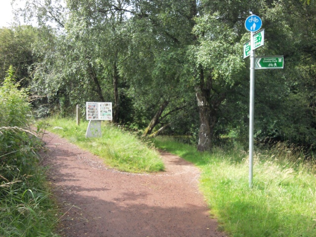 Take the path forking left, then turn right over a bridge; the right fork continues to follow the canal